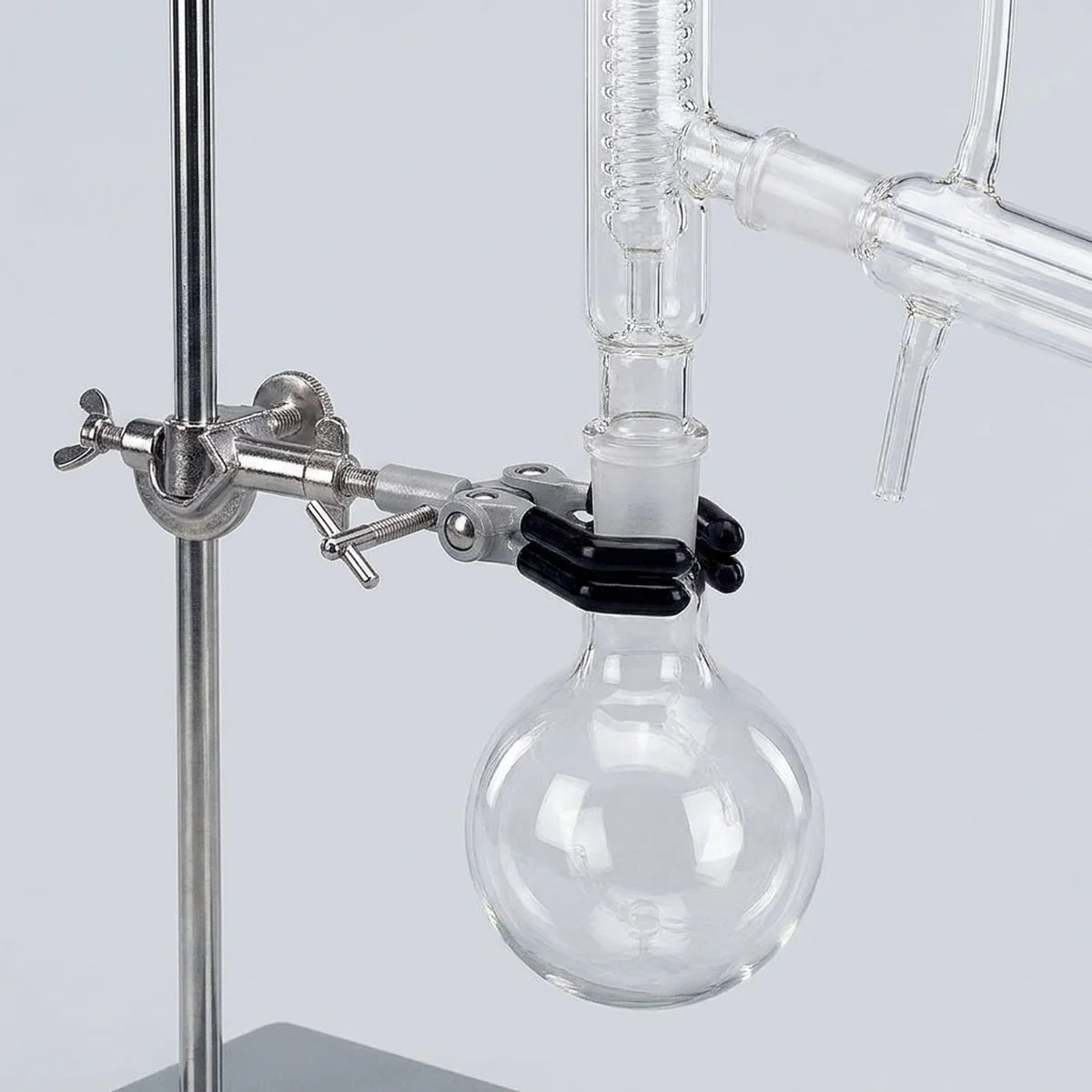 Flask clamped in distillation setup