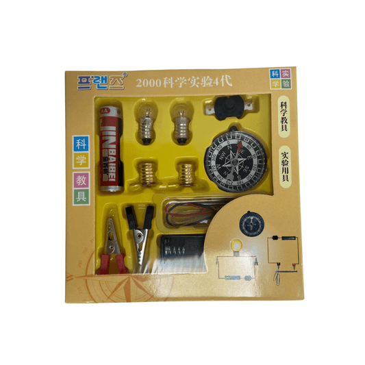 Starter Electric Circuit and Electromagnet Kit box front, showing the battery, bulbs, switch, crocodile clips, wires and compass through the display window