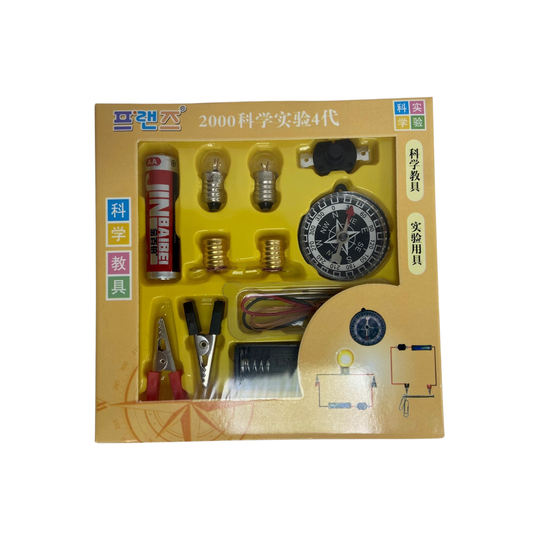 Starter Electric Circuit and Electromagnet Kit box front, showing the battery, bulbs, switch, crocodile clips, wires and compass through the display window