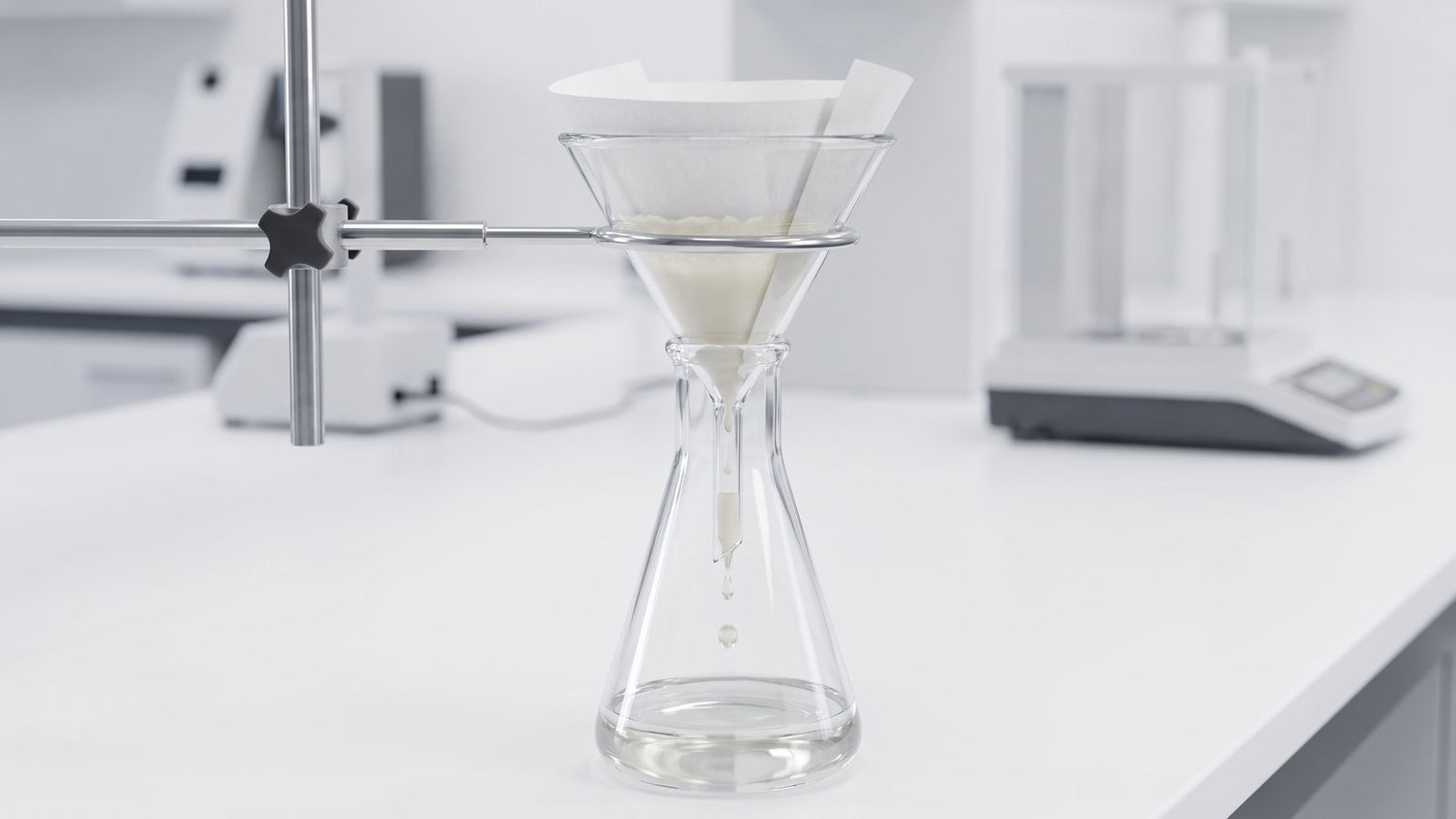 Filter paper cone in a funnel filtering liquid into a flask