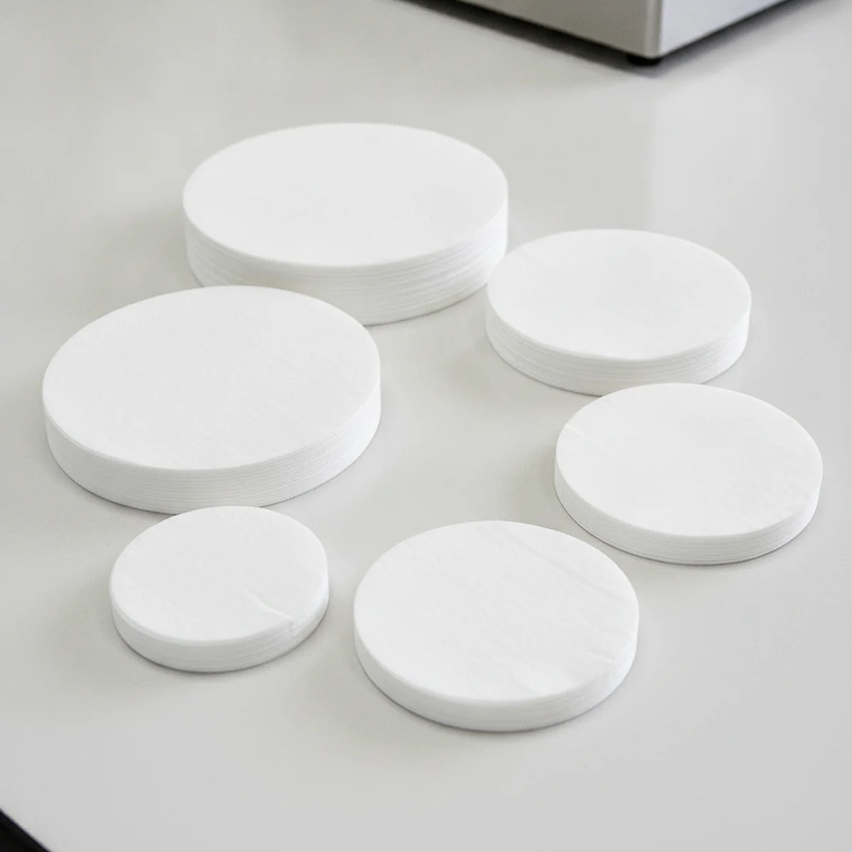 Stack of qualitative filter paper discs in different sizes