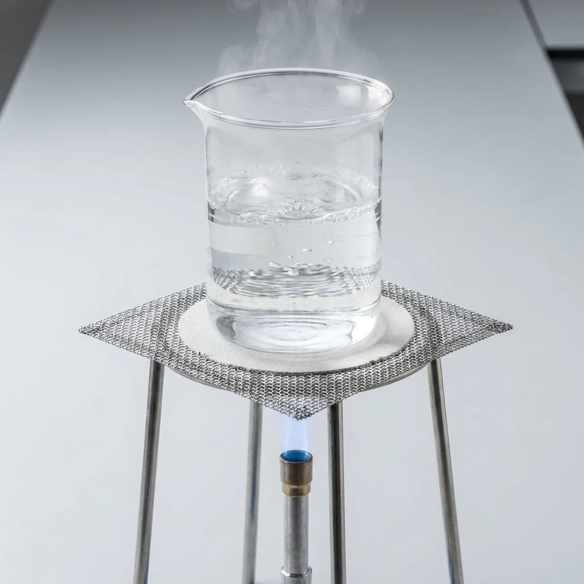 Beaker on wire gauze over tripod stand