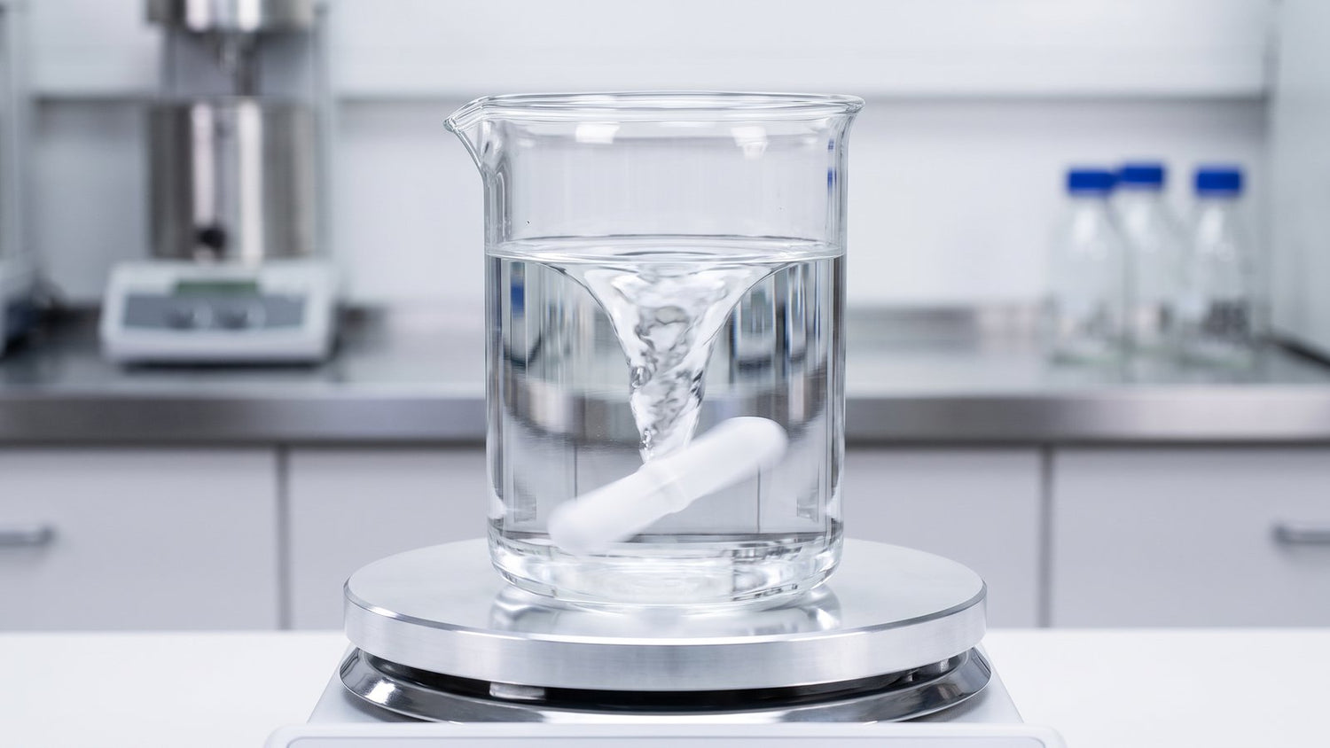 PTFE stir bar spinning inside a beaker on a magnetic stirrer