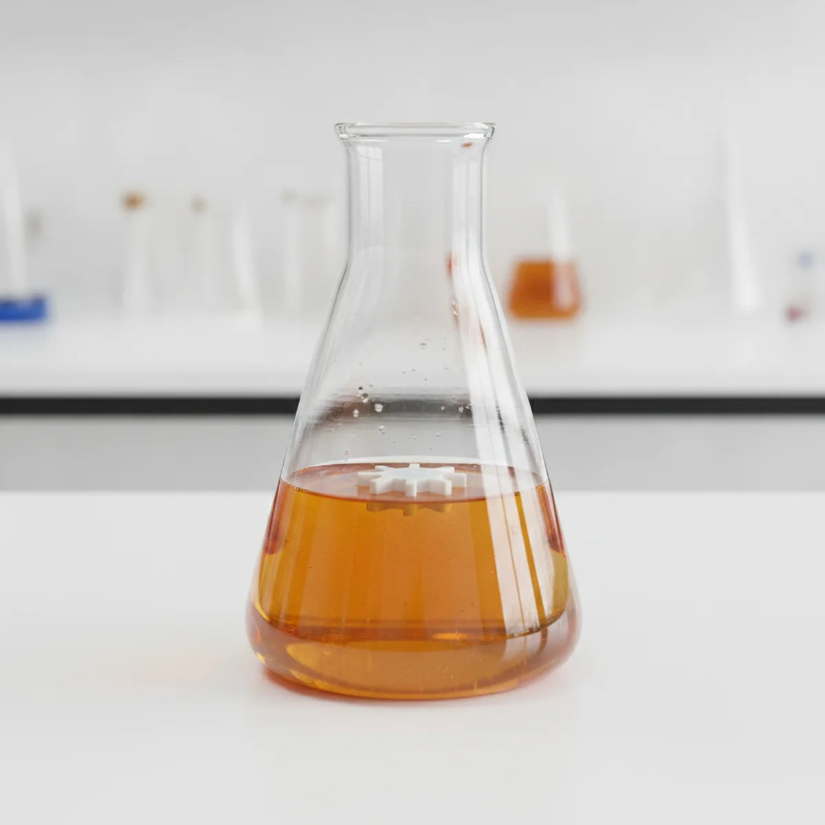 Octagonal stir bar in a flask of viscous liquid