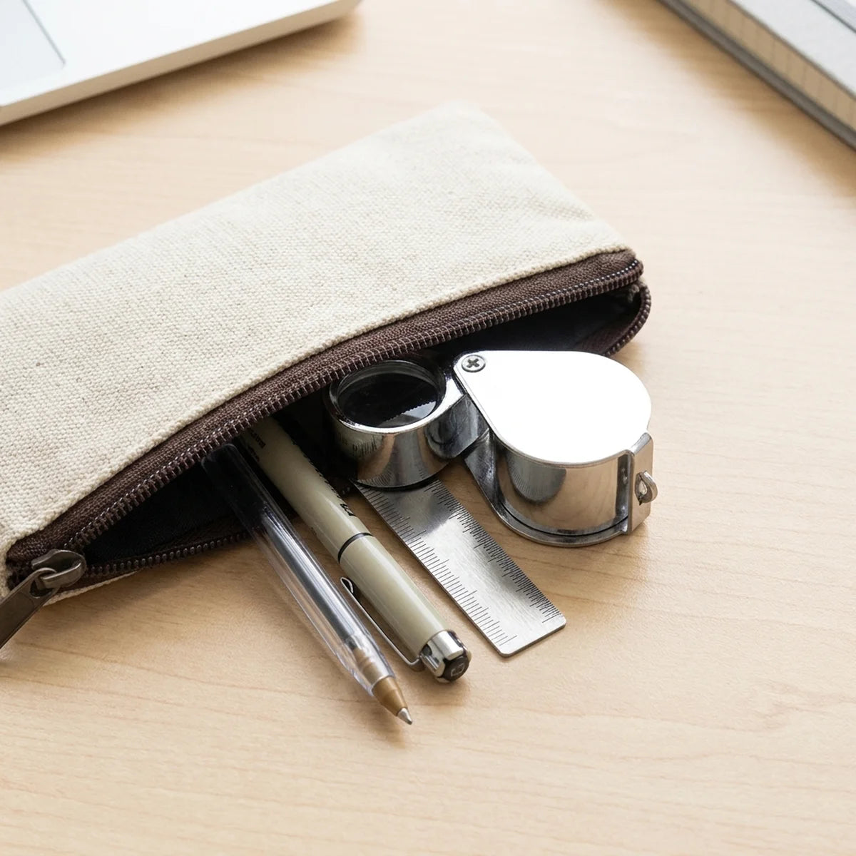 Compact folding magnifier in a pencil case
