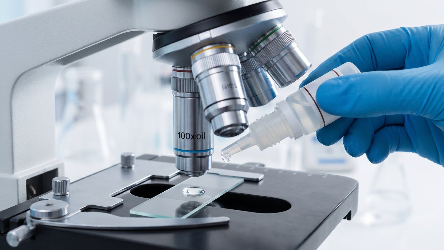 Applying immersion oil to a microscope slide under the 100x objective