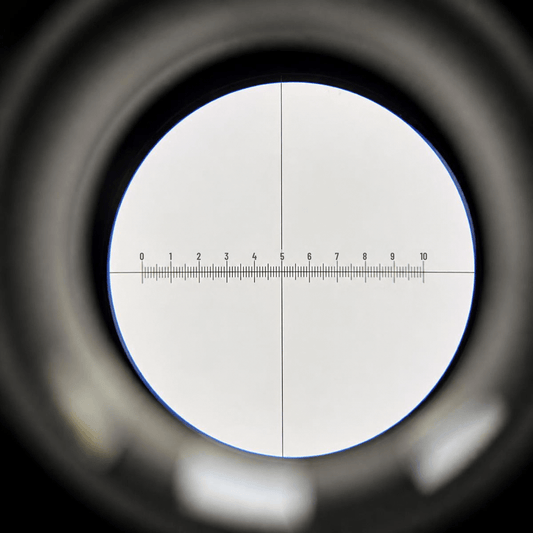 View through the WF16x eyepiece showing the 10mm micrometer scale and crosshair