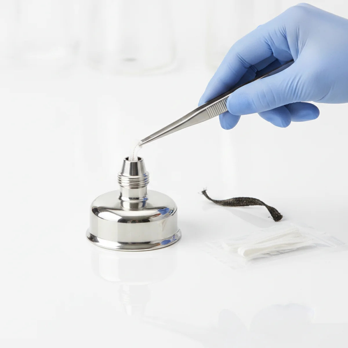 Replacing a worn wick in a stainless steel spirit lamp burner
