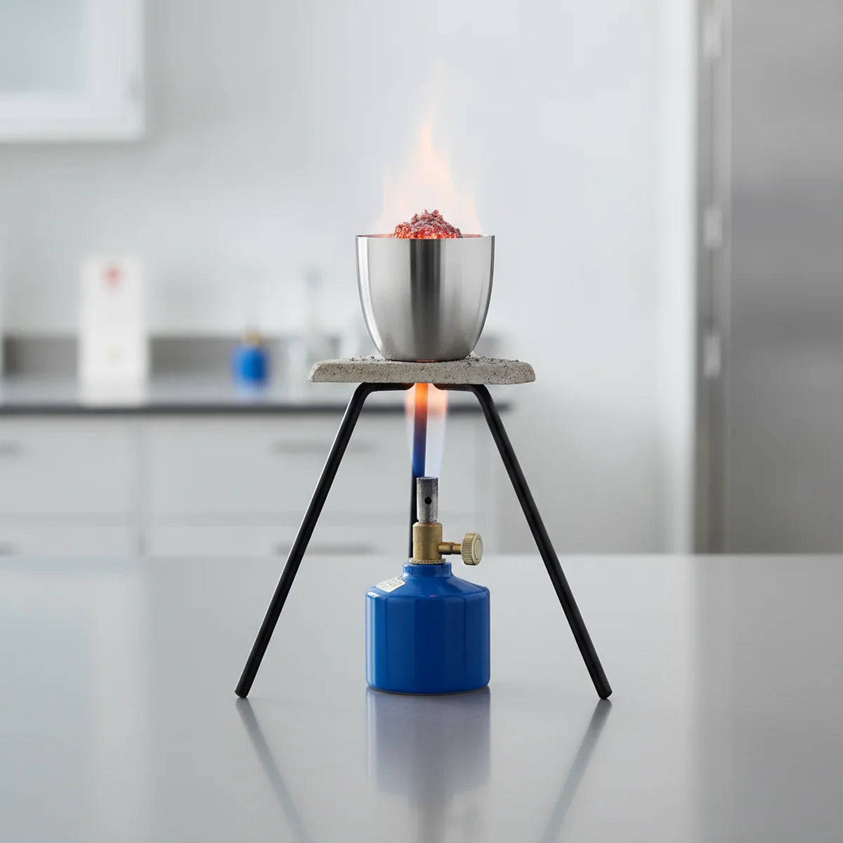 Stainless steel crucible ashing over Bunsen burner