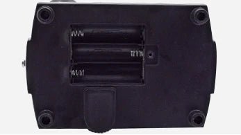 Battery compartment under a student microscope base holding three AA batteries