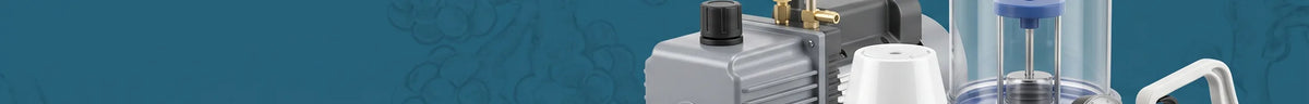 A rotary vane vacuum pump beside a filtration flask assembly