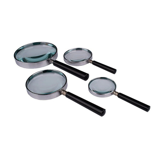 Handheld reading magnifier with metal frame and bakelite handle for enlarging small text and fine details.